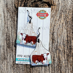 Sweet little hereford calf in succulents on ear tag shaped earrings