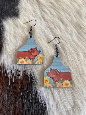 Ear tag shaped earrings featuring cute Duroc Pig in flowers print 