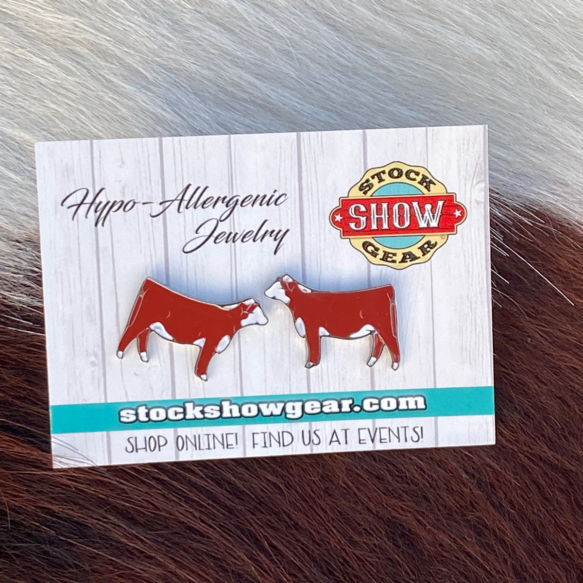 Red Hereford enamel hypo-allergenic post earrings displayed on card.